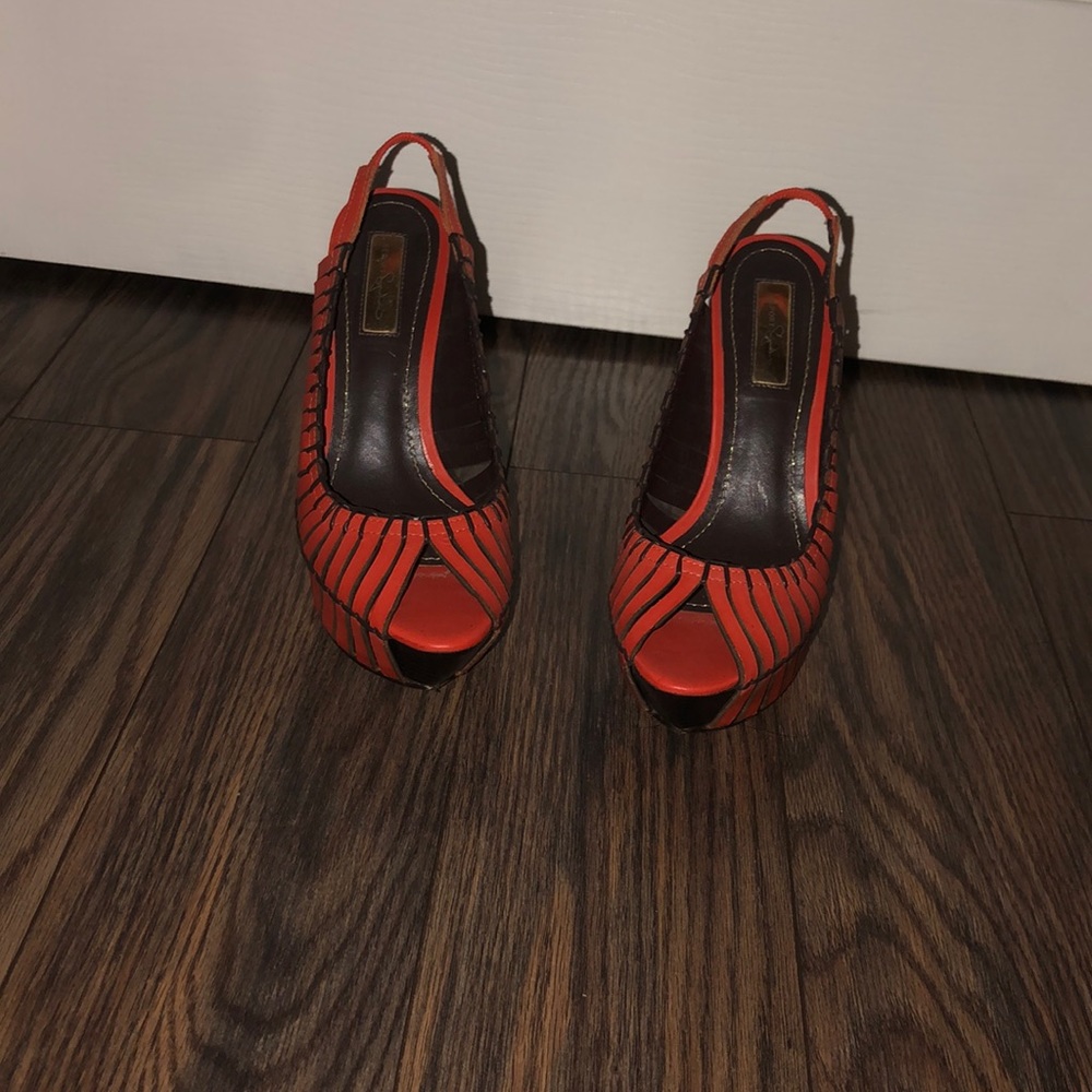 Report Signature orange pumps!